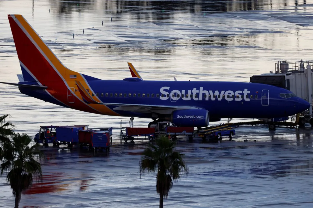 A Southwest Airlines jet sits at a gate at Orlando International Airport in Orlando, Fla., on Oct. 11, 2021. (Joe Skipper/Reuters)