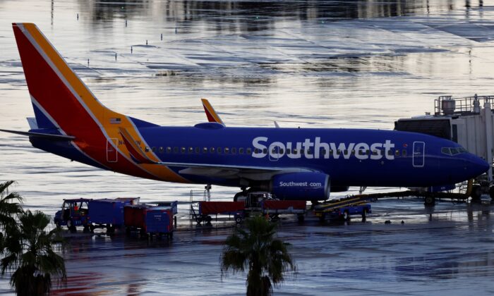 A Southwest Airlines jet sits at a gate at Orlando International Airport in Orlando, Fla., on Oct. 11, 2021. (Joe Skipper/Reuters)