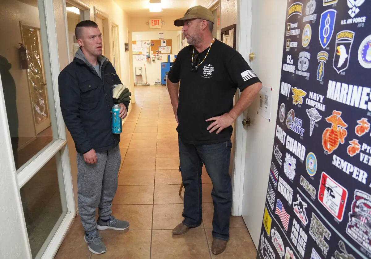 Tom West (R) founded Operation Transition Outside the Wire in August. Here, he speaks with one of his clients, Brendan Bosley, at the nonprofit's coffee production facility in Williams, Ariz., on Oct. 20. Proceeds from the sale of coffee go to support programs and services. (Allan Stein/Epoch Times)