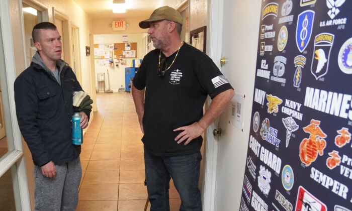 Tom West (R), founded Operation Transition Outside the Wire in August. Here he speaks with one of his clients, Brendan Bosley, at the nonprofit's coffee production facility in Williams, Arizona, on Oct. 20. Proceeds from the sale of coffee go to support programs and services. (Allan Stein/ Pezou)