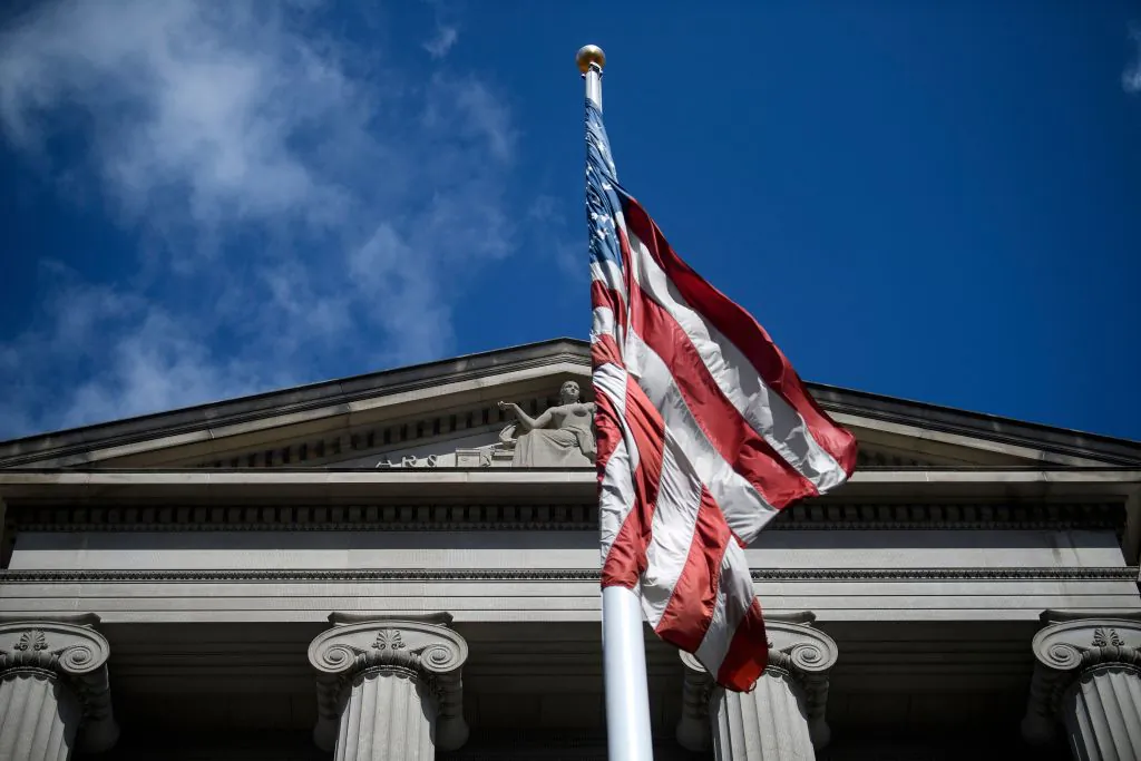 The American flag flies outside the U.S. Department of Justice in Washington, D.C. on March 22, 2019. (Brendan Smialowski/AFP/Getty Images)
