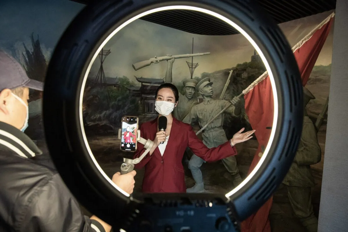 A staff member giving a live online broadcast presentation at the Museum of Wuchang Uprising of 1911 Revolution in Wuhan city, China's central Hubei Province, on April 13, 2020. (STR/AFP via Getty Images)