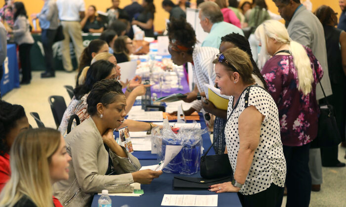 People attend a job fair put on by Miami-Dade County and other sponsors in Miami, Fla., on April 5, 2019. (Joe Raedle/Getty Images)