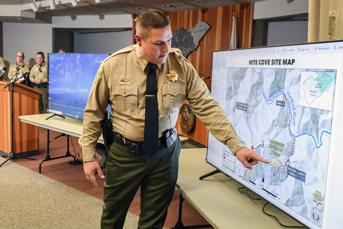 Mariposa County Sheriff Jeremy Briese points to a map to show where a missing family was found dead during a news conference in Mariposa, Calif., on Oct. 21, 2021. (Craig Kohlruss/The Fresno Bee via AP)