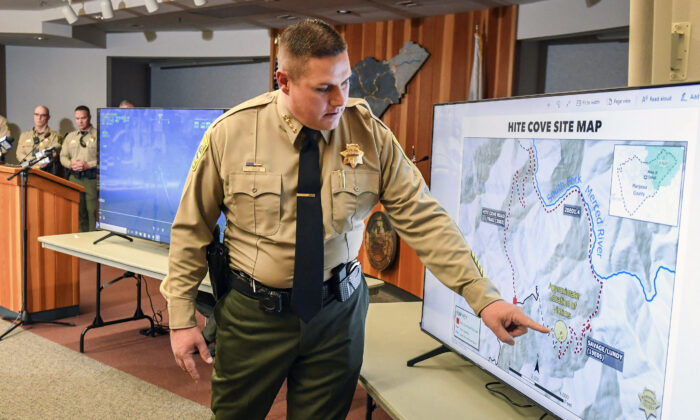 Mariposa County Sheriff Jeremy Briese points to a map to show where a missing family was found dead during a news conference in Mariposa, Calif., on Oct. 21, 2021. (Craig Kohlruss/ Fresno Bee via AP)