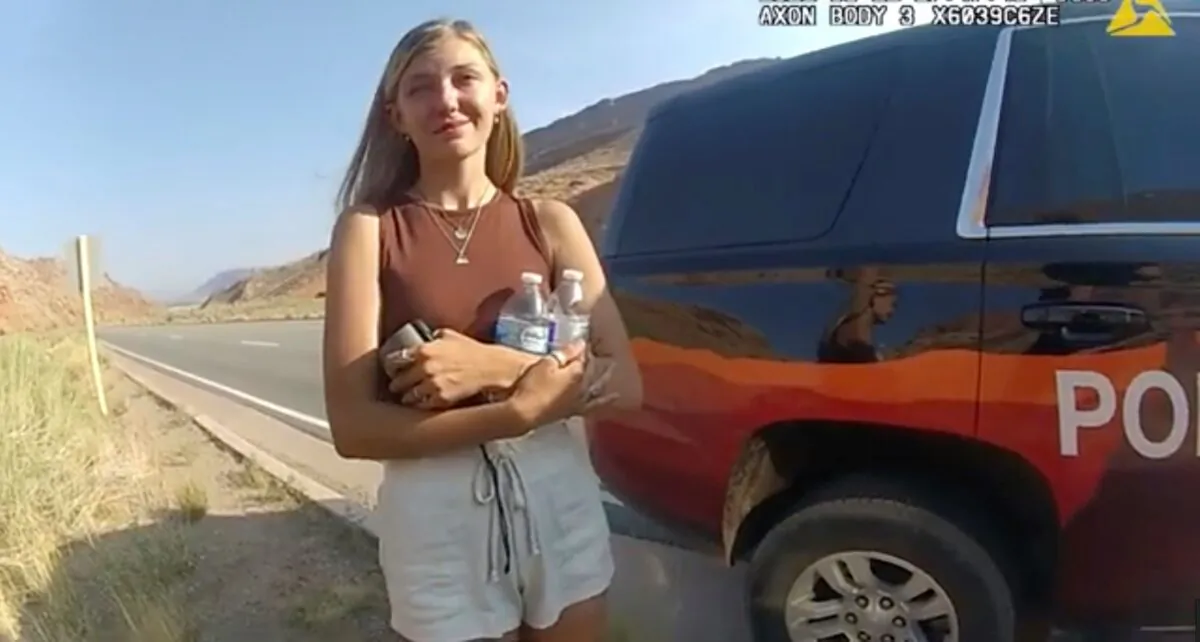 This police camera video provided by The Moab Police Department shows Gabrielle "Gabby" Petito talking to a police officer after police pulled over the van she was traveling in with her boyfriend. (Moab Police Department via AP)