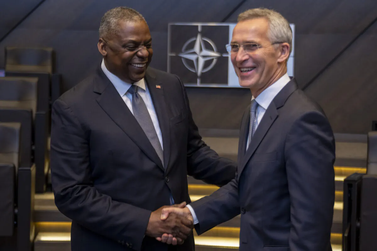 Secretary of Defense Lloyd J. Austin III shares a laugh with NATO Secretary General Jens Stoltenberg at the NATO defense ministerial at NATO headquarters in Brussels, Belgium, on Oct. 22, 2021. (Chad J. McNeeley/Department of Defense)