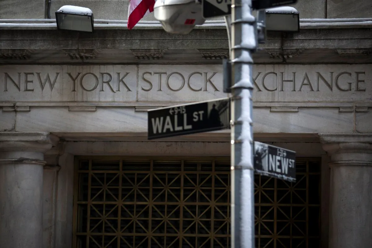The Wall St. sign is seen outside the door to the New York Stock Exchange in New York's financial district on  Feb. 4, 2014.  (Brendan McDermid/Reuters)
