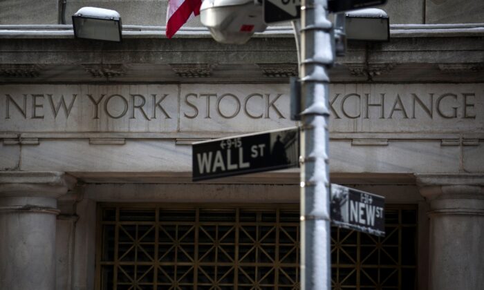  Wall St. sign is seen outside the door to the New York Stock Exchange in New York's financial district on  Feb. 4, 2014.  (Brendan McDermid/Reuters)