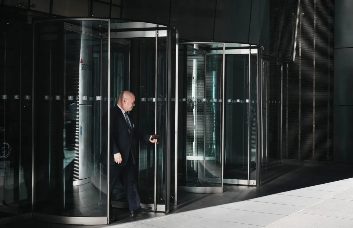 A man walks out of a office building in midtown Manhattan, New York City, on Oct. 1, 2021. (Spencer Platt/Getty Images)