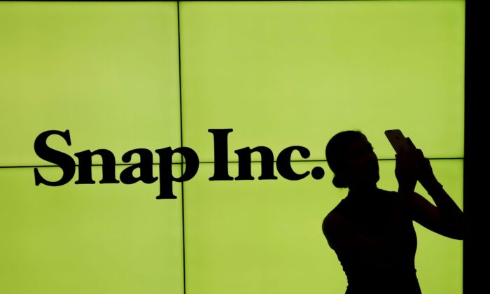 A pistillate   stands successful  beforehand   of the logo of Snap Inc connected  the level  of the New York Stock Exchange (NYSE) successful  New York City, N.Y., connected  March 2, 2017. (Lucas Jackson/Reuters)