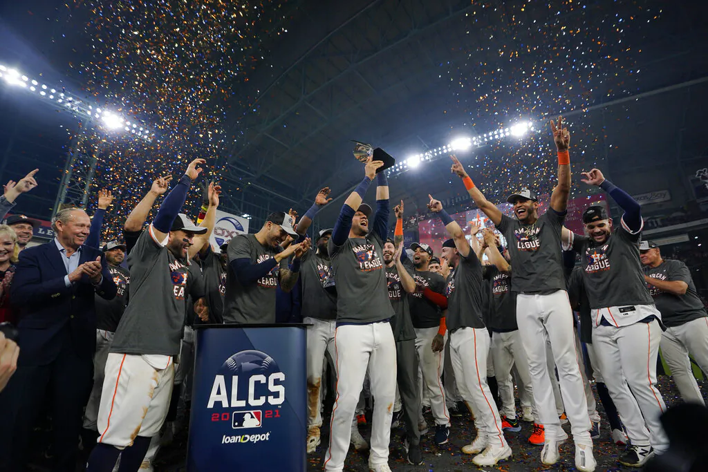 The Houston Astros celebrate their win against the Boston Red Sox in Game 6 of baseball's American League Championship Series in Houston, Texas, on Oct. 22, 2021. (David J. Phillip/AP Photo)