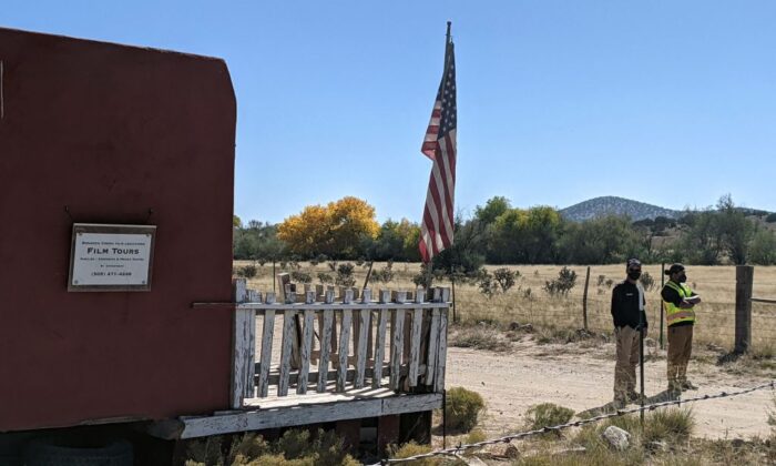 Security guards stand at the entrance of Bonanza Creek Ranch in Santa Fe, N.M., on Oct. 22, 2021. (Anne Lebreton/AFP via Getty Images)