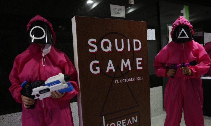 Participants take part in an event where they play the games of Netflix smash hit "Squid Game" at the Korean Cultural Centre in Abu Dhabi, on Oct. 12, 2021. (Giuseppe Cacace / AFP via Getty Images)