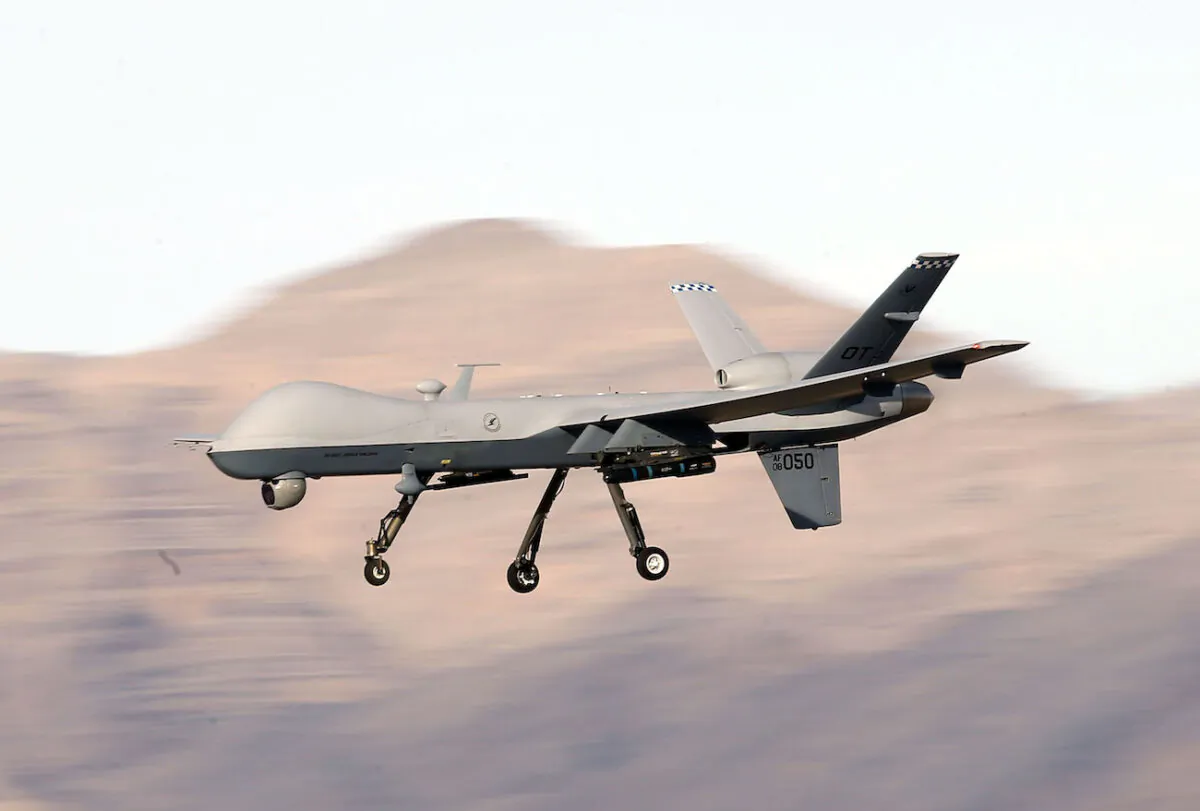 An MQ-9 Reaper remotely piloted aircraft flies by during a training mission at Creech Air Force Base in Indian Springs, Nev., on Nov. 17, 2015. (Isaac Brekken/Getty Images)