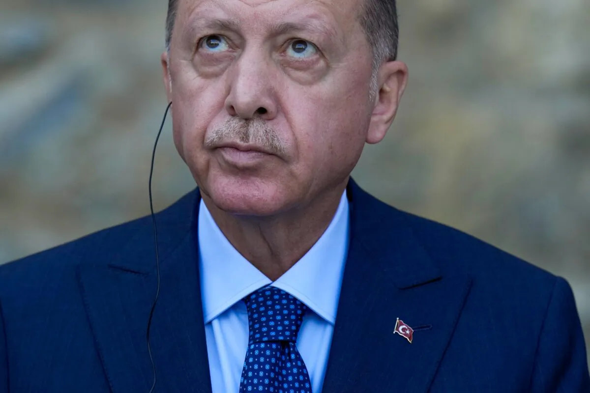 Turkey's President Recep Tayyip Erdogan looks up during a joint news conference with German Chancellor Angela Merkel following their meeting at Huber Villa presidential palace, in Istanbul, on Oct. 16, 2021. (Francisco Seco /AP Photo)