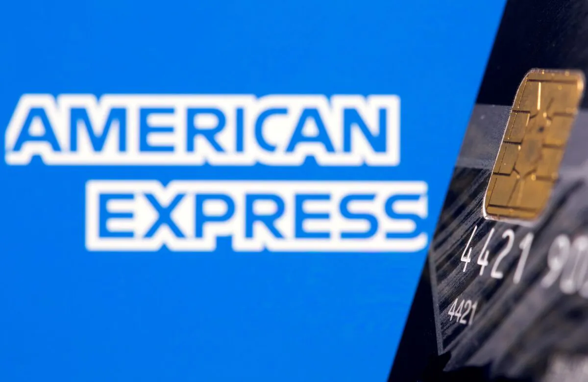 Credit card is seen in front of displayed American Express logo in this illustration taken on July 15, 2021. (Dado Ruvic/Reuters)