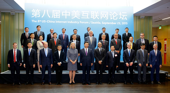 Chinese leader Xi Jinping (front row, C) poses for a photo with a group of CEOs and other executives at the main campus of Microsoft Corp. in Redmond, Wash., on Sept. 23, 2015. Pictured are: (front row, L-R): Facebook's Mark Zuckerberg, JD.com's Liu Qiangdong, Cisco's John Chambers, Alibaba's Jack Ma, IBM's Ginni Rometty, Xi Jinping, Microsoft's Satya Nadella, China's internet czar Lu Wei, Apple's Tim Cook, Tencent's Pony Ma, and Amazon's Jeff Bezos. (Ted S. Warren/Pool/Getty Images)