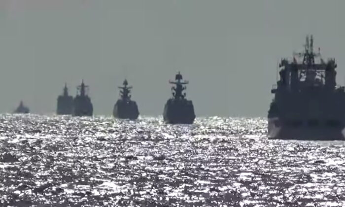 A group of naval vessels from Russia and China conduct a joint maritime military patrol in the waters of the Pacific Ocean, in this still image taken from video released on Oct. 23, 2021. (Russian Defence Ministry/Handout via Reuters)