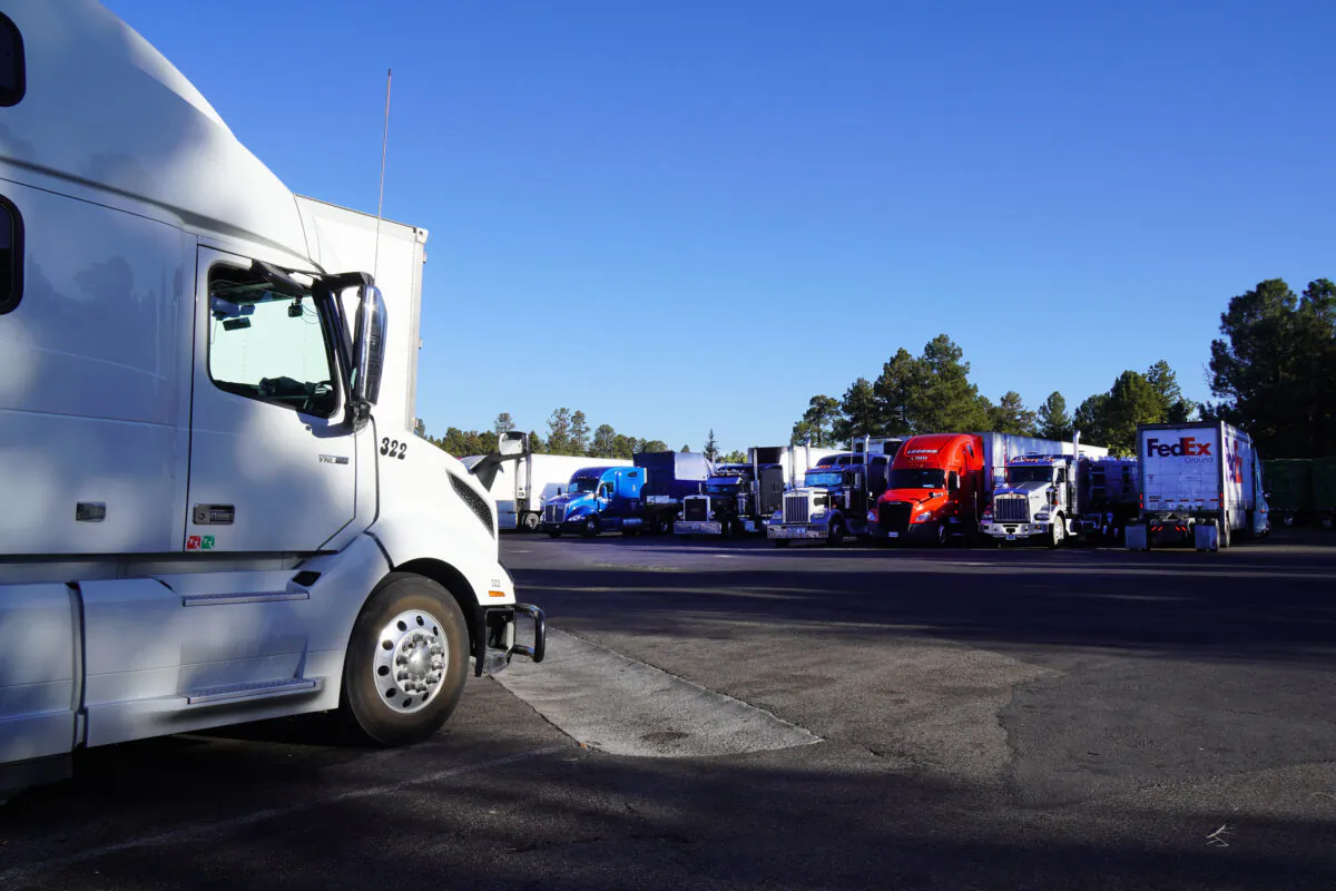 Long-distance truck drivers park their rigs at Little America truck stop in Flagstaff, Ariz., on Oct. 19, 2021. (Allan Stein/The Epoch Times)