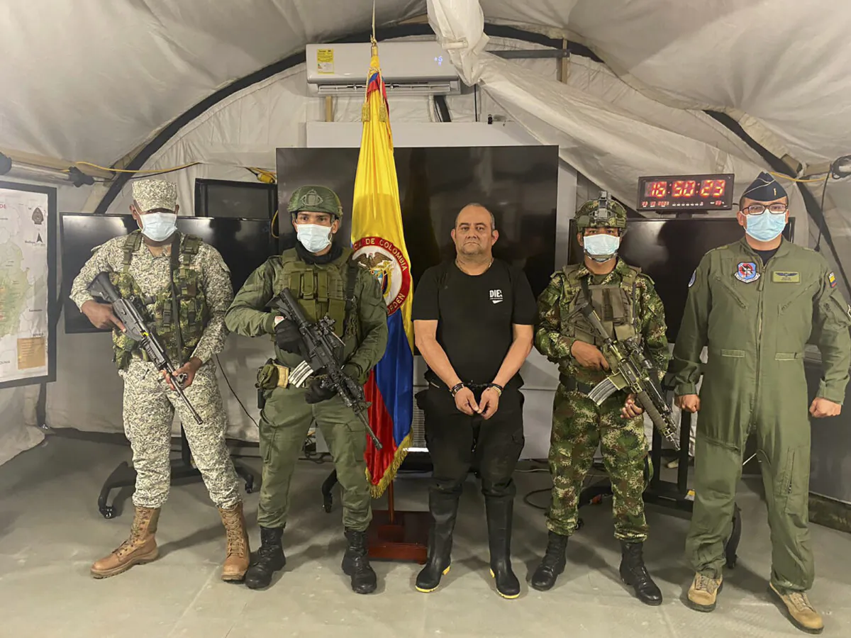Dairo Antonio Úsuga, alias “Otoniel,” leader of the violent Clan del Golfo cartel, is presented to the media at a military base in Necocli, Colombia, on Oct. 23, 2021.  (Colombian presidential press office via AP)
