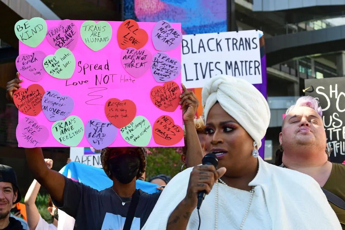 People rally in support of a Netflix transgender walkout protesting a Dave Chappelle comedy special, in Los Angeles on Oct. 20, 2021. (Frederic J. Brown/AFP via Getty Images)