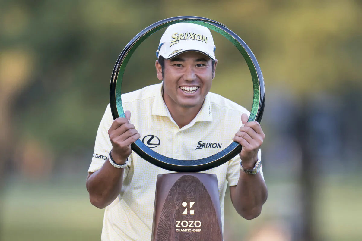Hideki Matsuyama of Japan poses with the trophy after winning the final round of the Zozo Championship golf tournament at Accordia Golf Narashino Country Club in Inzai, Chiba Prefecture, Japan, on Oct. 24, 2021. (Tomohiro Ohsumi/AP Photo)
