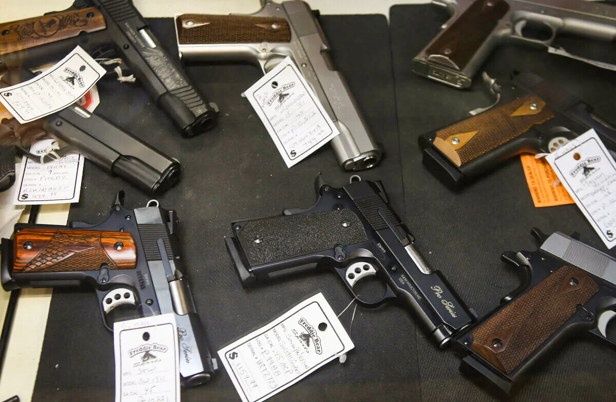 Pistols are offered for sale at Freddie Bear Sports in Tinley Park, Ill., on Oct. 18, 2012. (Scott Olson/Getty Images)