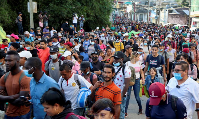 A caravan consisting of migrants from Central America and Haiti make their way through Tapachula, in Chiapas state, Mexico, on Oct. 23, 2021. (Jose Torres/Reuters)