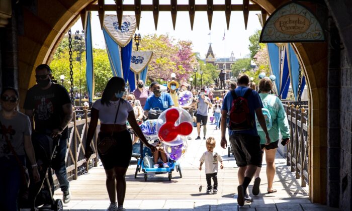 Visitors pass through Sleepy Beauty Castle at Disneyland Resort in Anaheim, Calif., on May 3, 2021. (Jay L. Clendenin/Los Angeles Pezou/TNS)