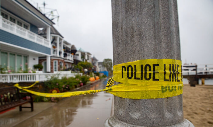 Newport Beach Police and HAZMAT Units investigate three deaths and one injury at a Balboa Island Home in Newport Beach, Calif., on Oct. 25, 2021. (John Fredricks/The Epoch Times)