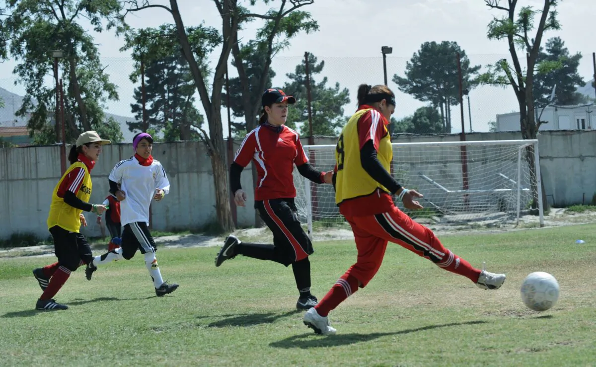 Members of Afghanistan's national women’s soccer team take part in a practice session in Kabul on June 20, 2010. The current team managed to escape Afghanistan after the recent takeover by the Taliban, which forbids women and girls to play sports. (Massoud Hossaini/AFP via Getty Images)