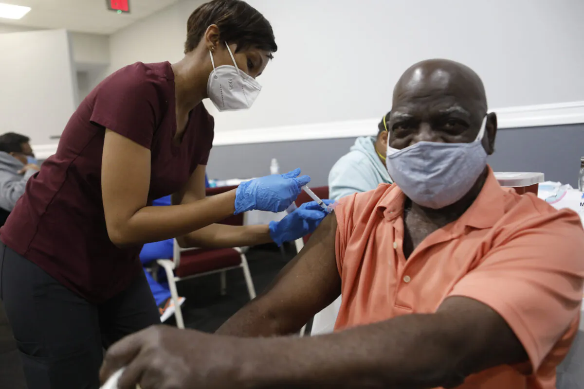 Bible-Based Fellowship Church partnered with the Pasco County Health Department, and Army National Guard to assist residents who are 65 and older to administer the Moderna Covid-19 vaccine in Tampa, Fla., on Feb. 13, 2021. (Octavio Jones/Getty Images)