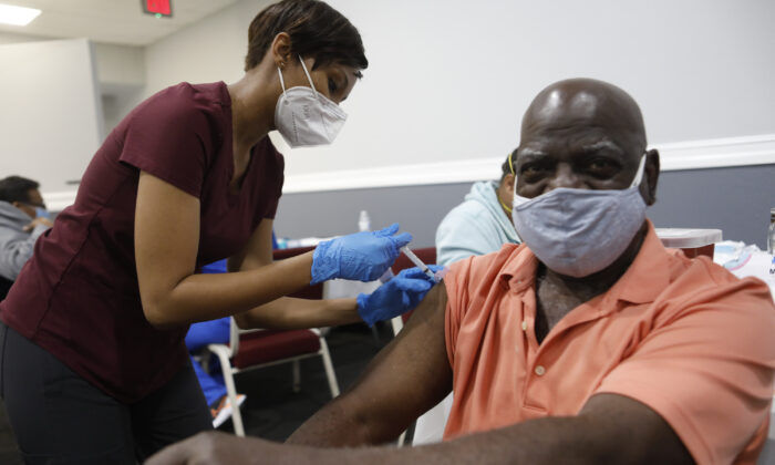 Bible-Based Fellowship Church partnered with the Pasco County Health Department, and Army National Guard to assist residents who are 65 and older to administer the Moderna Covid-19 vaccine in Tampa, Fla., on Feb. 13, 2021. (Octavio Jones/Getty Images)
