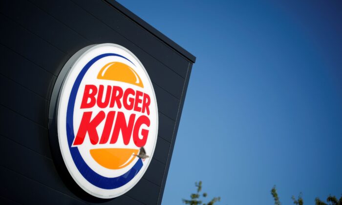  Burger King company logo stands on a sign outside a restaurant in Bretigny-sur-Orge, near Paris, France on July 30, 2020. (Benoit Tessier/Reuters)