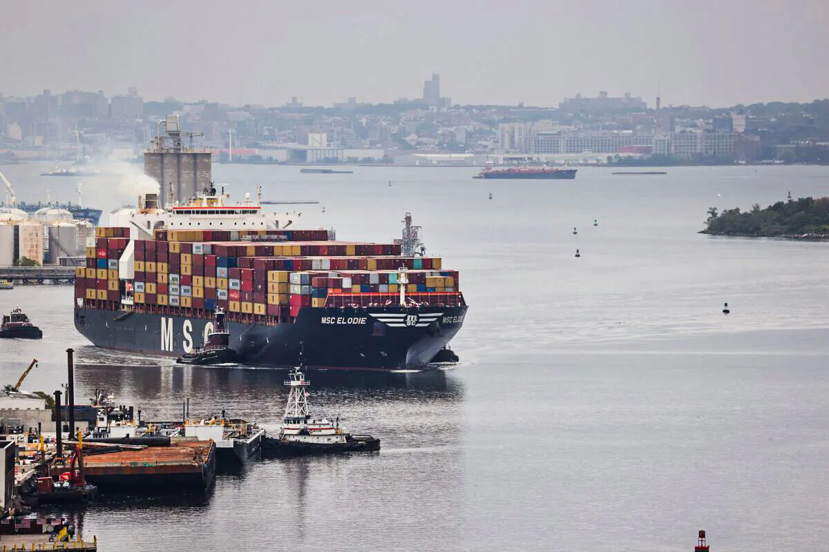 A cargo ship moves toward the Bayonne Bridge as it heads into port in Bayonne, N.J., on Oct. 13, 2021. (Spencer Platt/Getty Images)