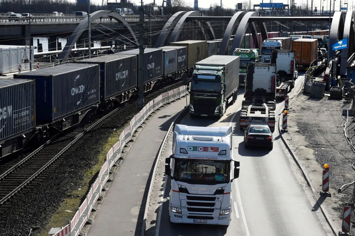 Containers are transported to loading terminals in the port in Hamburg, Germany on March 11, 2020. (Fabian Bimmer/Reuters)
