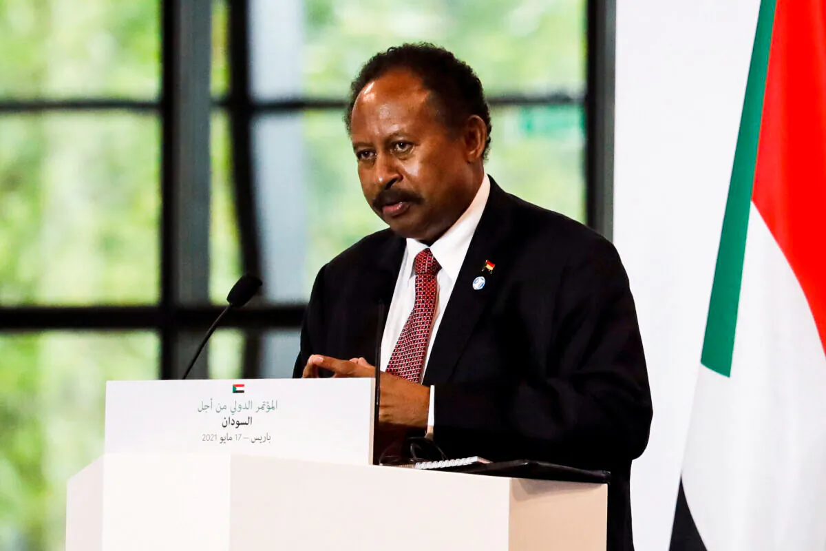 Sudan's Prime Minister Abdalla Hamdok attends a joint news conference with French President Emmanuel Macron and Sudan's Sovereign Council Chief General Abdel Fattah al-Burhan (not seen) during the International Conference in support of Sudan at the Temporary Grand Palais in Paris, France on May 17, 2021. (Sarah Meyssonnier/Pool/Reuters)