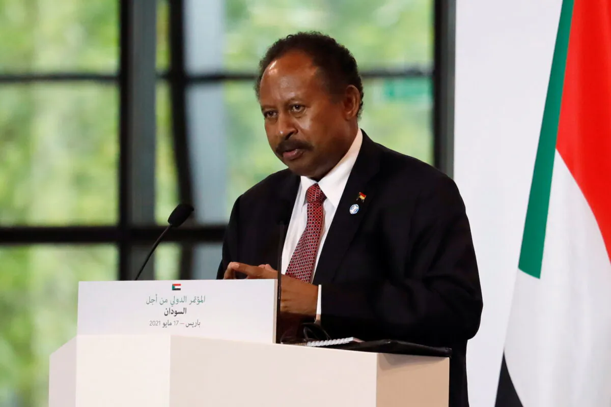 Sudan's Prime Minister Abdalla Hamdok attends a joint news conference with French President Emmanuel Macron and Sudan's Sovereign Council Chief General Abdel Fattah al-Burhan (not seen) during the International Conference in support of Sudan at the Temporary Grand Palais in Paris on May 17, 2021. (Sarah Meyssonnier/Pool/Reuters)