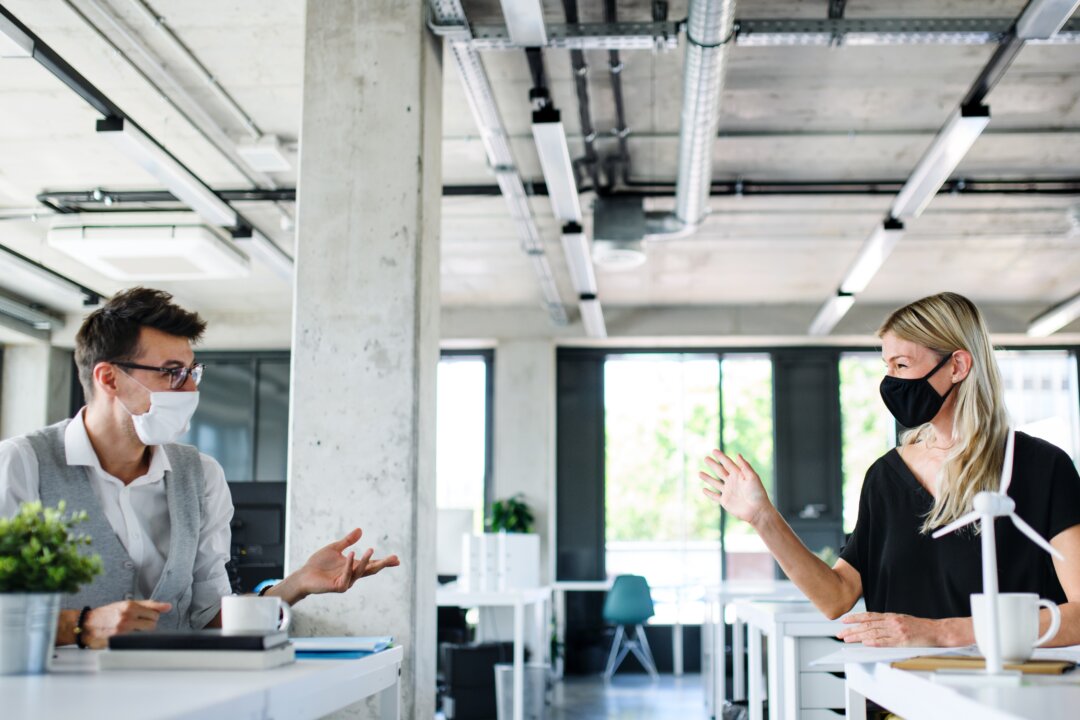 Social distancing is supposedly critical to reduce COVID-19 infections, but the actual science on how the virus is spread suggests otherwise. (Halfpoint/Shutterstock)