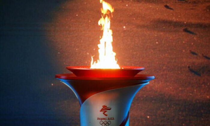  Olympic flame burns in a cauldron at the ceremony in Beijing, China, on Oct. 20, 2021. (Tingshu Wang/Reuters)