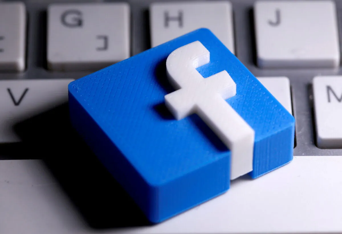 A 3D-printed Facebook logo is seen placed on a keyboard in this illustration on March 25, 2020. (Dado Ruvic/Reuters)
