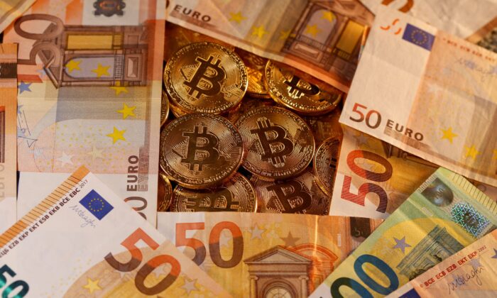 Representations of virtual currency Bitcoin and euro banknotes are seen successful  this representation   illustration connected  Jan. 27, 2020. (Dado Ruvic//Reuters)