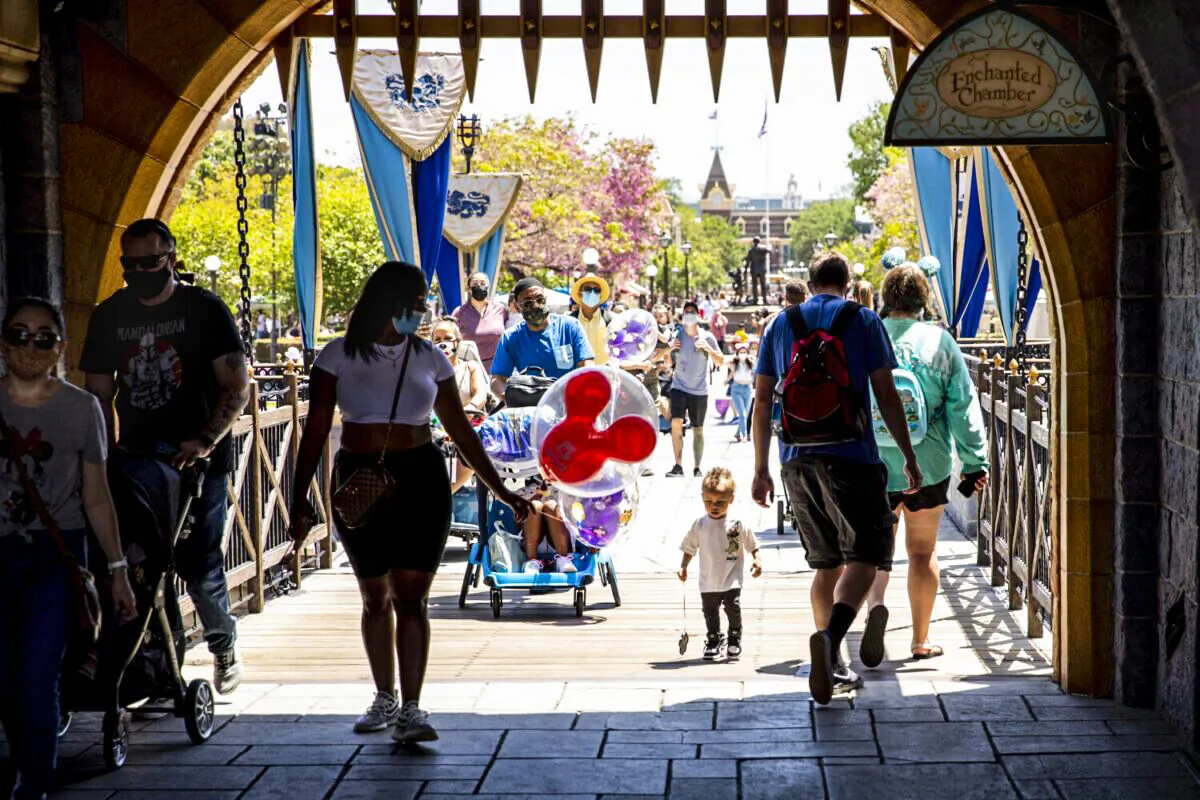 Visitors pass through Sleepy Beauty Castle at Disneyland Resort in Anaheim, Calif., on May 3, 2021. (Jay L. Clendenin/Los Angeles Times/TNS)
