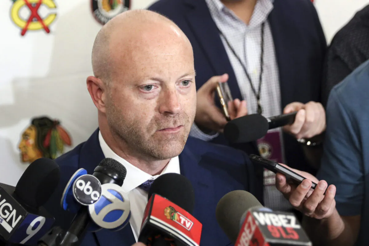 Then-Chicago Blackhawks General Manager Stan Bowman speaks to the media during the team's convention in Chicago on July 26, 2019. (Amr Alfiky/AP Photo)