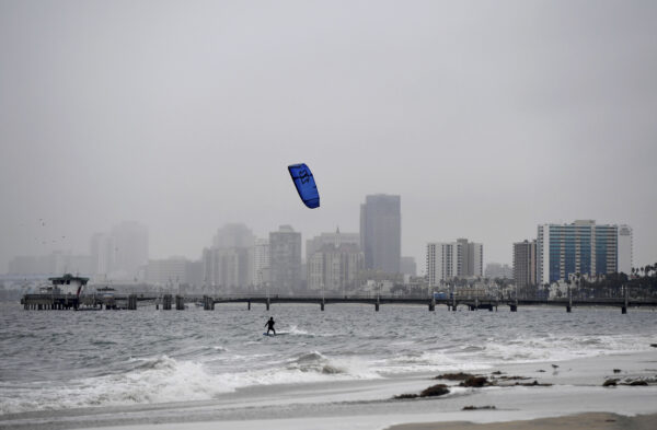 A wind surfer surfs