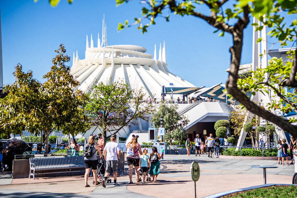 Guests arrive in Tomorrowland at the Disneyland Resort  in Anaheim, Calif., on April 30, 2021. (Richard Harbaugh/Disneyland Resort via Getty Images)