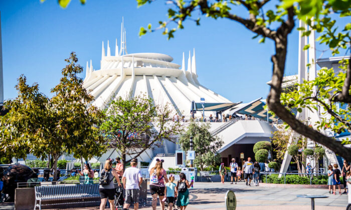 Guests arrive in Tomorrowland at the Disneyland Resort  in Anaheim, Calif., on April 30, 2021. (Richard Harbaugh/Disneyland Resort via Getty Images)
