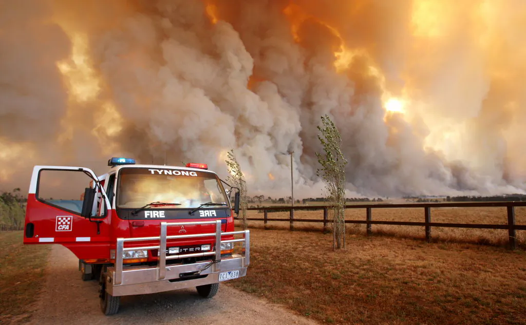 Country Fire Authority (CFA) staff monitor a giant fire raging in the Bunyip State Park, some 125 kilometres west of Melbourne, Australia on Feb. 7, 2009.  (William West/AFP via Getty Images)
