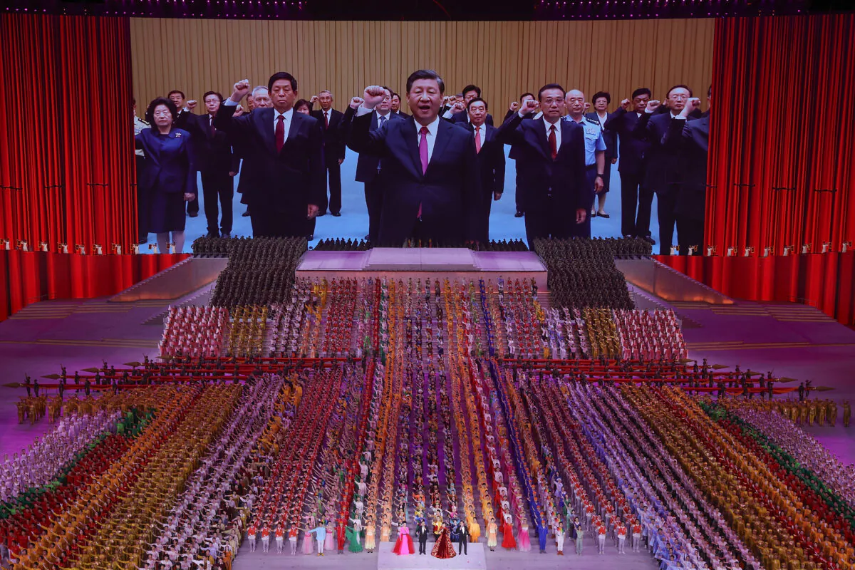 A large screen showing Chinese communist leader Xi Jinping during an art performance on June 28, 2021 in Beijing. (Lintao Zhang/Getty Images)